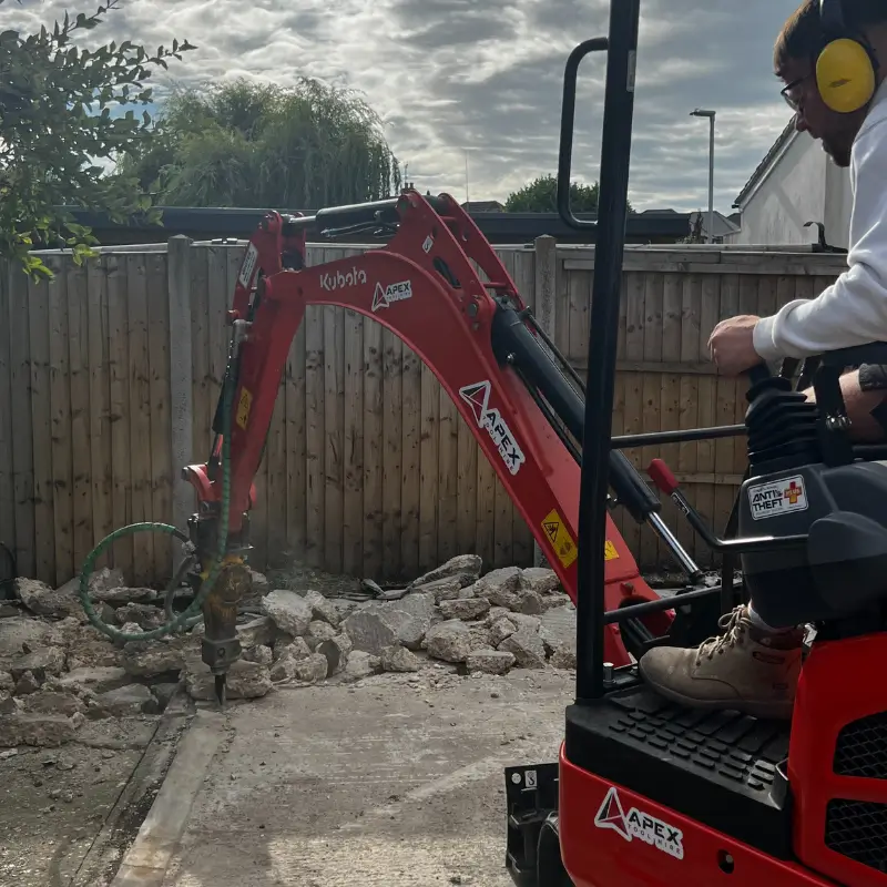 HAL Construction using a digger in Bournemouth to break up concrete base